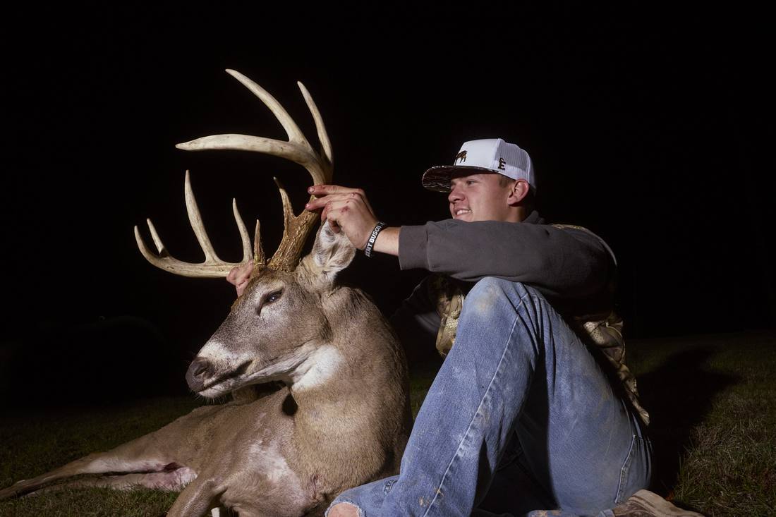Young hunter with his whitetail buck